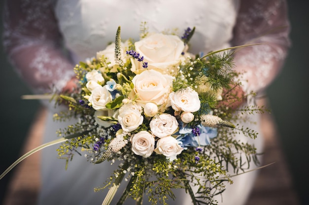 close-up of bride holding bouquet