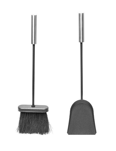 Photo close-up of broom and dustpan against white background