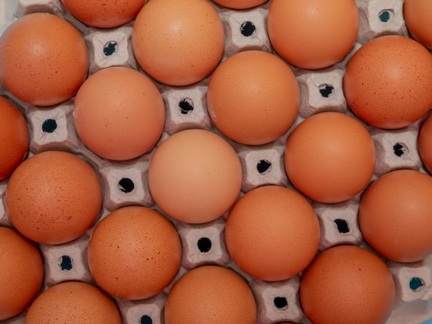 Close up on brown eggs in egg box