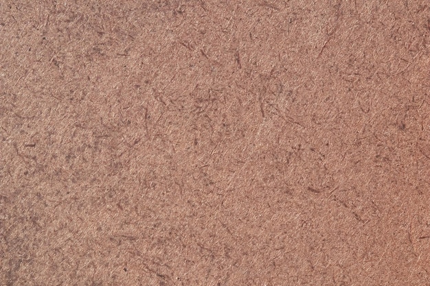 A close up of a brown fibreboard background High quality photo