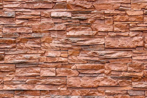 Close up of a brown wall of bricks