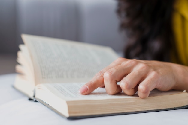 Close-up brunette girl with book