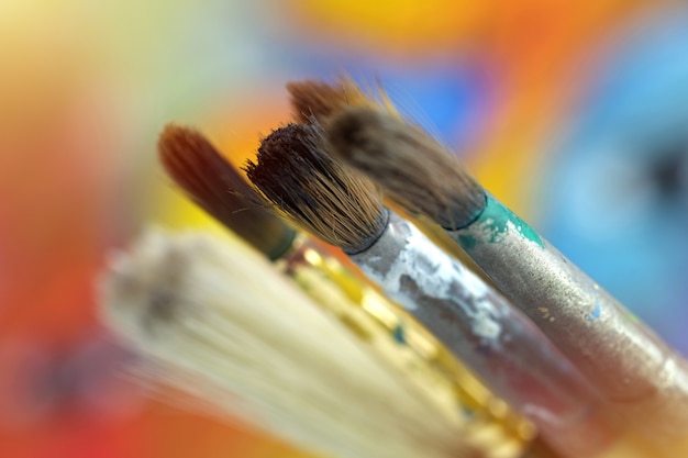 Close up a brush, paint, artist on blur background