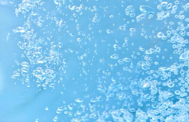 Photo close-up of bubbles against blue background