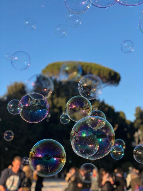 Close-up of bubbles against sky