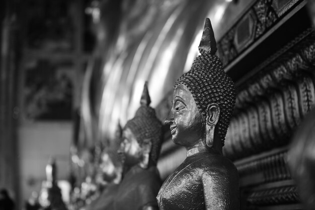 Close-up of buddha statue against building