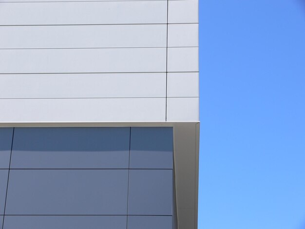 Close-up of built structure against blue sky