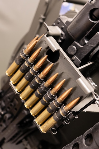 Photo close up of of bullets in a coaxial machine gun belt