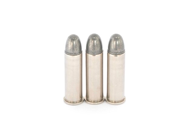 Photo close up of bullets on white background