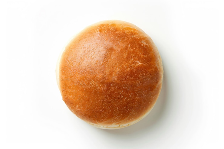 Photo a close up of a bun on a white surface