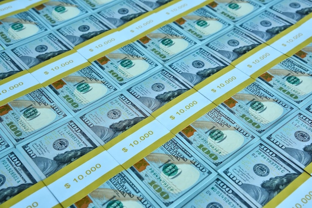 Close up of bundles of one hundred dollar bills on table