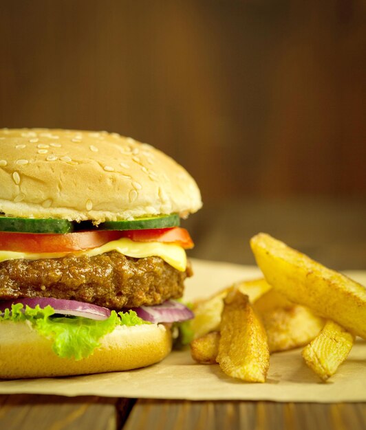 Photo close-up of burger in plate on table