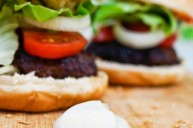 Close-up of burgers on cutting board