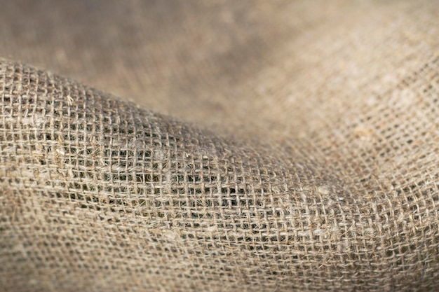 織り目加工の自然な背景として黄麻布の袋のクローズ アップ