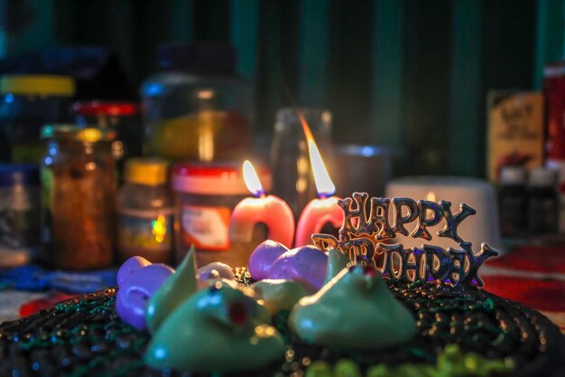 Close-up of burning candles on birthday cake