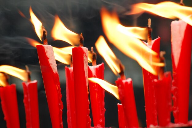 Close-up of burning candles in temple