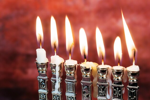 Close-up of burning candles in temple