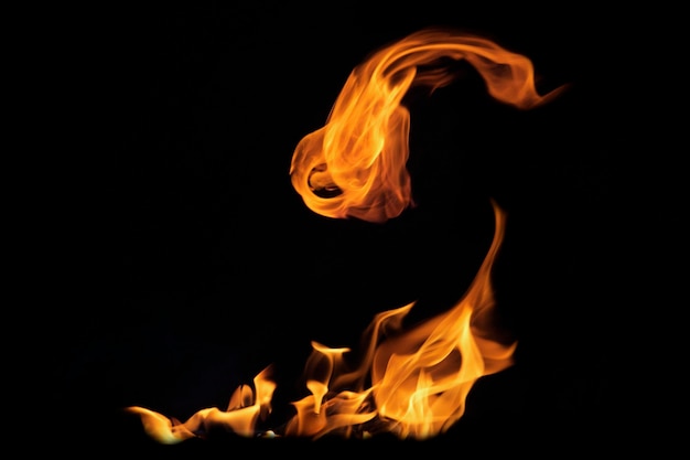 Close up burning flames on black background for graphic design or wallpaper