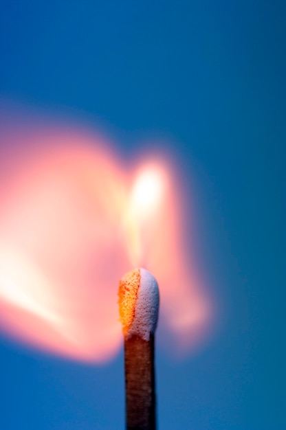 Close-up of a burning match