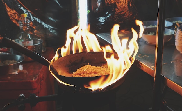 Photo close-up of burning stoveon barbecue grill street food in thailand