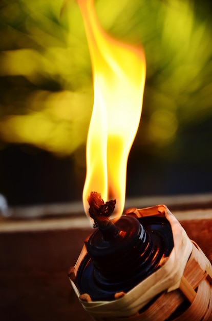 Close-up of burning tiki torch