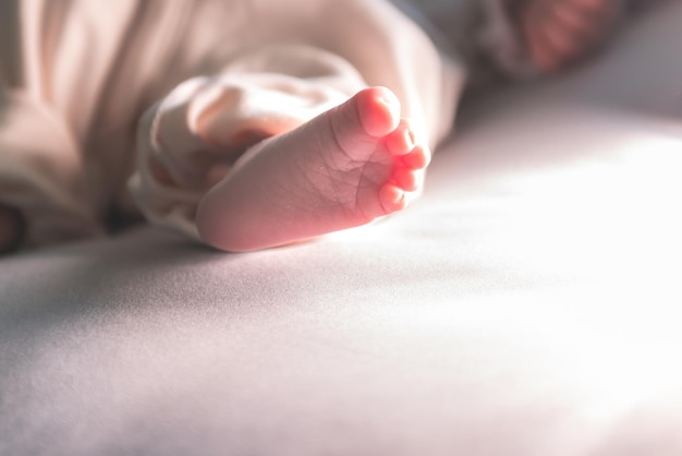 Close up and burred soft images Feet of 7dayold Asian baby newborn