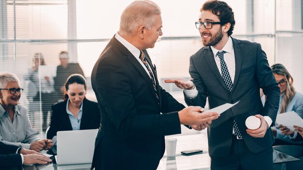 Close up business colleagues discussing good news