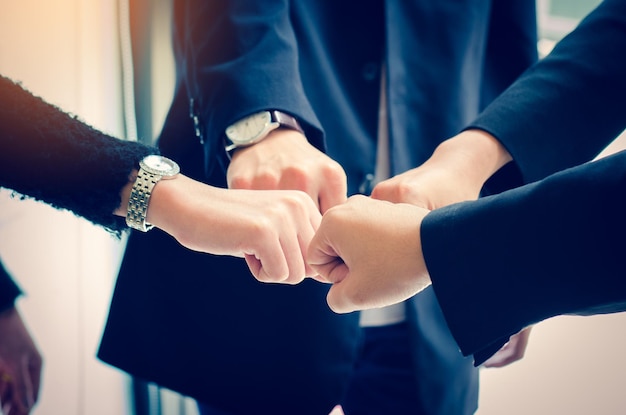 Close-up of business colleagues gesturing in office