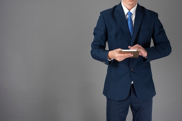 Close up of business man is using tablet 