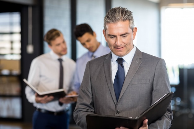 Close-up of business man with his organizer in the office