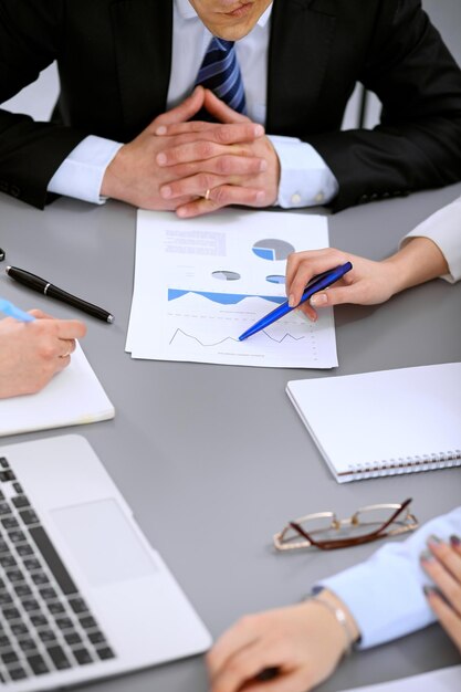 Close up of business people at meeting.