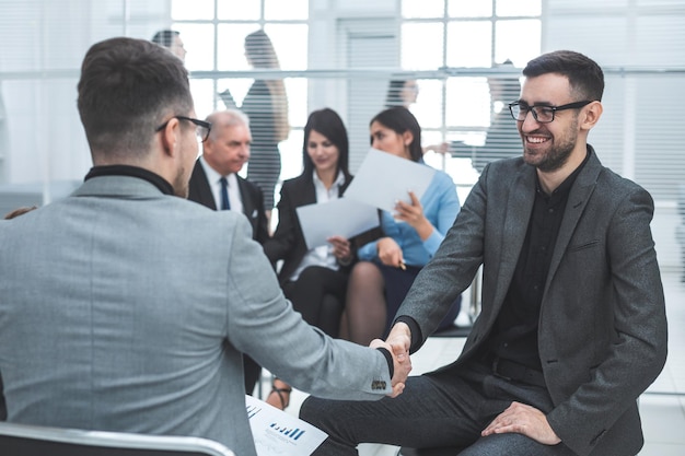 Close up. business people shaking hands in agreement. success concept