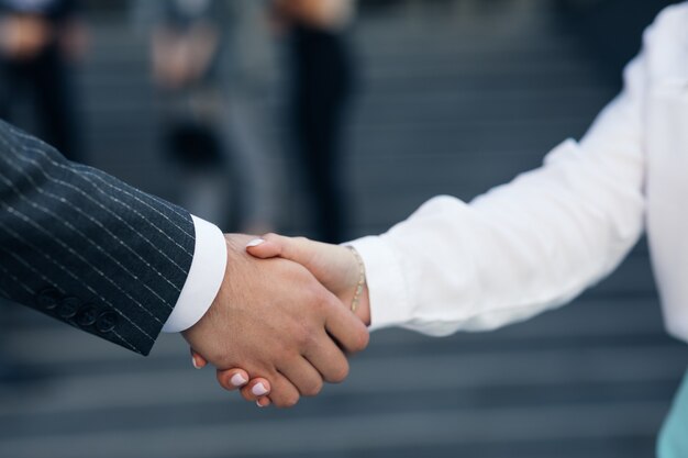 Close up Business People Shaking Hands Corporate Partnership Deal Welcoming Opportunity for Cooperation. Handshake of two people. Successful deal concept.