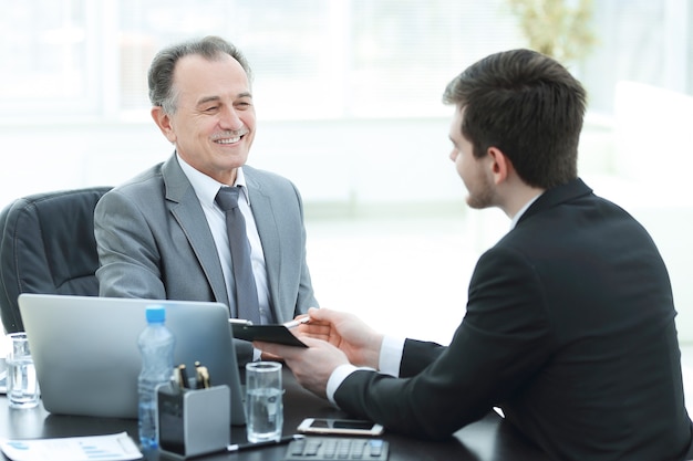 Close up.business people talking at a Desk. meetings and partnership