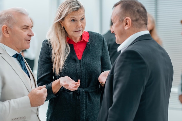 Close up business people talking standing in the office business concept