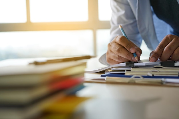 Close-up of business person working in office