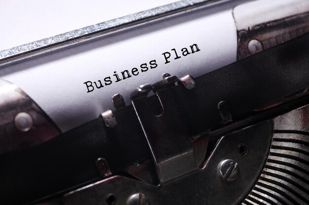 close-up of business plan text on paper in vintage typewriter