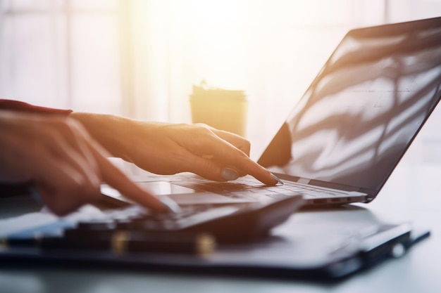 Close up of Business team analyzing income charts and graphs with modern laptop computer Business analysis and strategy concept