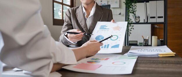 Close up of Business team analyzing income charts and graphs with modern laptop computer Business analysis and strategy concept