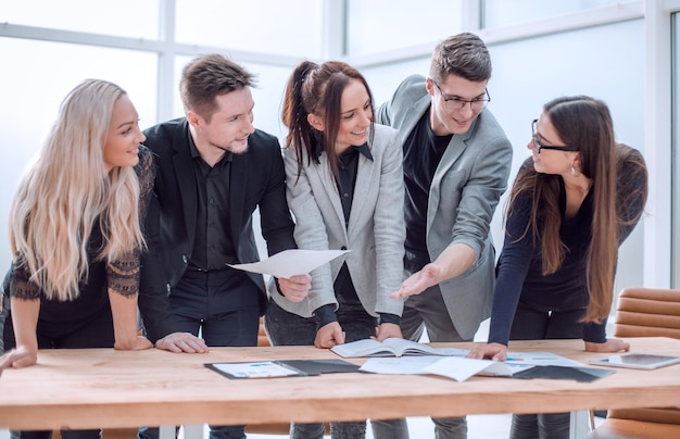 Close up business team enthusiastically discuss working documents