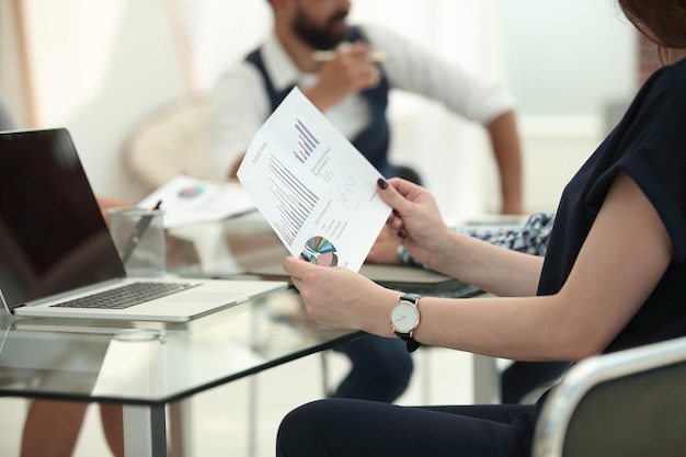 Close up business woman analyzing financial data