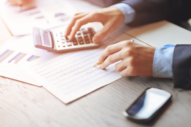 Close up.the businessman calculates the financial profit