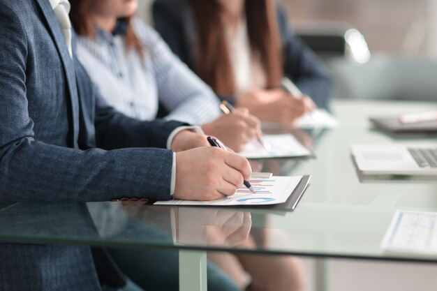 Close up.businessman checking the financial schedule.business concept.