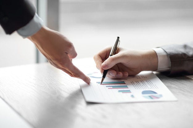 Close up.the businessman checks the financial data