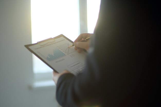 Close up businessman checks the financial schedulephoto with copy space