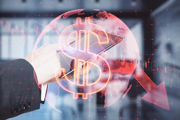 Photo close up of businessman hand pointing at mobile phone with falling global red dollar arrow hologram on blurry background market fall recession and finance concept double exposure