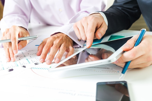 Close up of businessman hands while business meeting