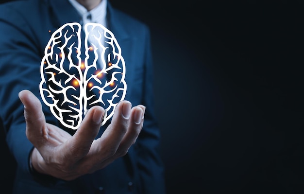 Close up of businessman holding digital image of brain