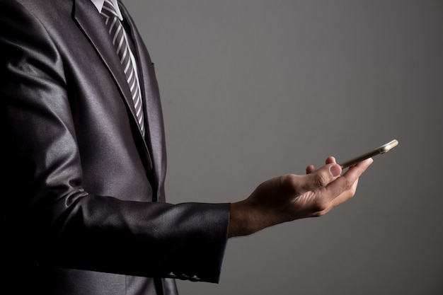 Close up of businessman playing multimedia 