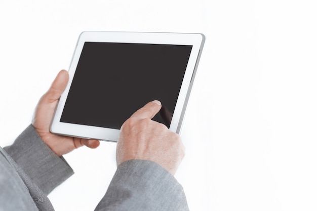 Close up.businessman pointing finger at the blank screen tablet.isolated on white wall.